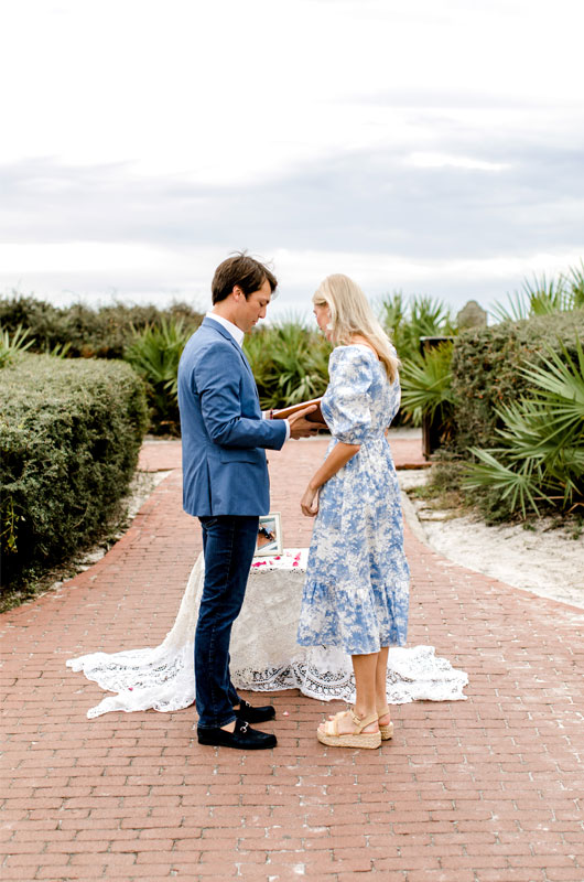 Kara And Chadwick’s Sunny Rosemary Beach Engagement Chadwick Putting The Ring On