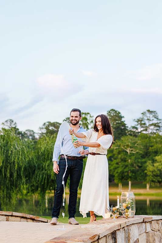 An Italian Garden Inspired Wedding At The Farm At High Shoals In Bishop, Georgia Popping Champagne