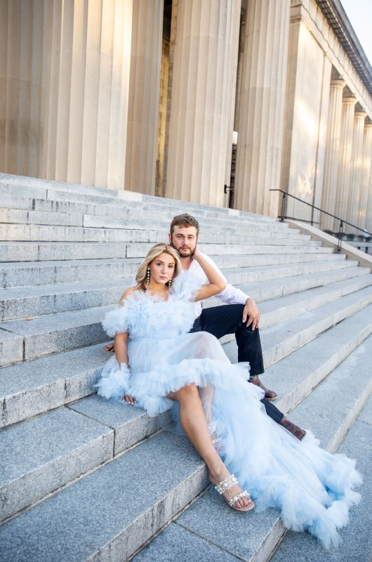 Kurstan Buck and Grant Hyams Nashville Engagement on steps sitting