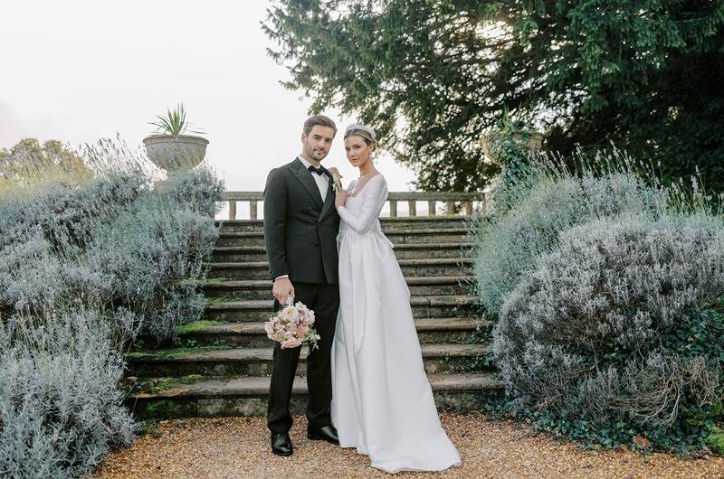 Royal Wedding Inspired Shoot Sudeley Castle Chetleham England couple on stairs Royal Wedding Inspired Shoot Sudeley Castle Chetleham England couple on stairs