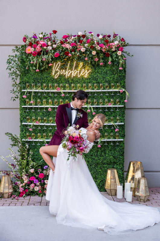 Trendsetter Award Chateau Elan Bride & Groom in front of Champagne Wall