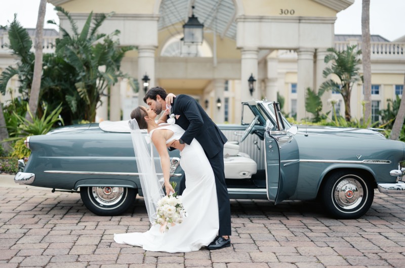 Uncorked Occasions Wins Best Design Award-The Styled Challenge, Bride Groom Kissing in front of Car Uncorked Occasions Wins Best Design Award-The Styled Challenge, Bride Groom Kissing in front of Car