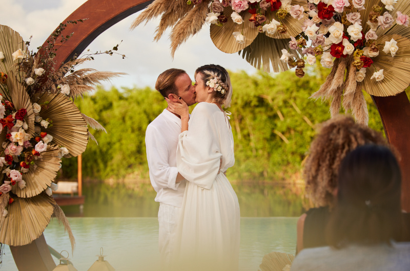 Eco Luxury fairmont mayakoba bride and groom at altar kiss Eco Luxury fairmont mayakoba bride and groom at altar kiss