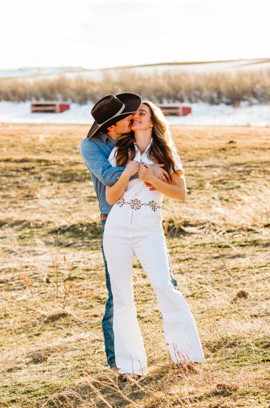 southern belle meets montana cowboy keagan carolines snowy mountain engagement embrace