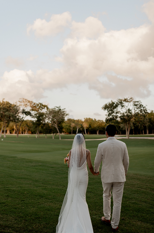 mango weddings maya riviera wedding example izzy and robert couple in field