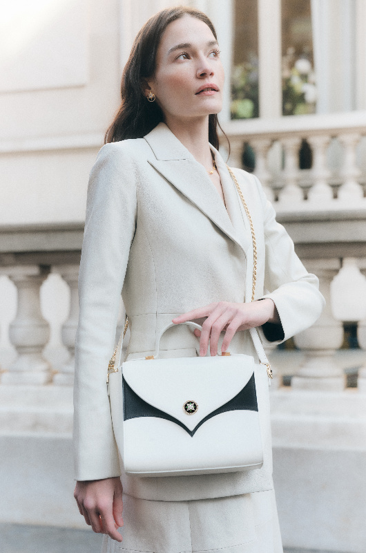 Inside 11 Juillet How This Luxury Brand Is Redefining Modern Craftsmanship the white handbag white pantsuit