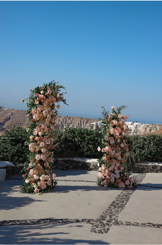 Santorini Wedding Style Intimate Morning Shoot And Sunset Elopement flower ceremony arch