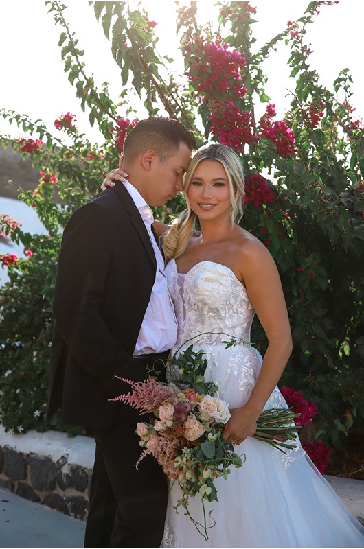 Santorini Wedding Style Intimate Morning Shoot And Sunset Elopement couple with bouquet